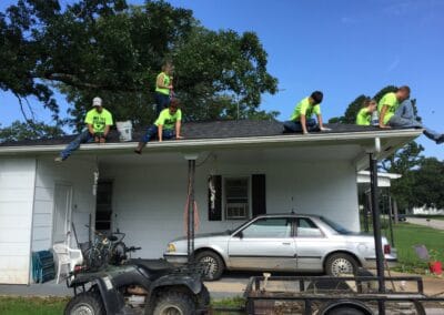 Volunteers repairing the roof
